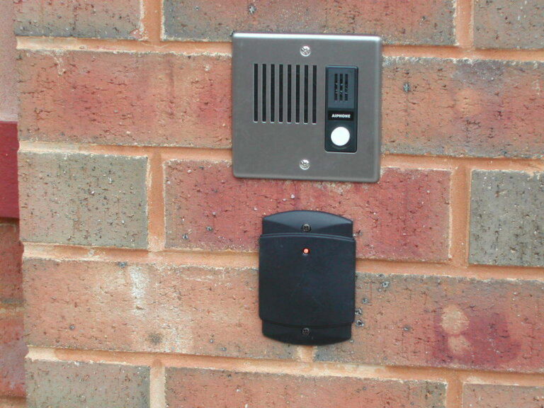 Key switch and access control panel installed at a property entrance